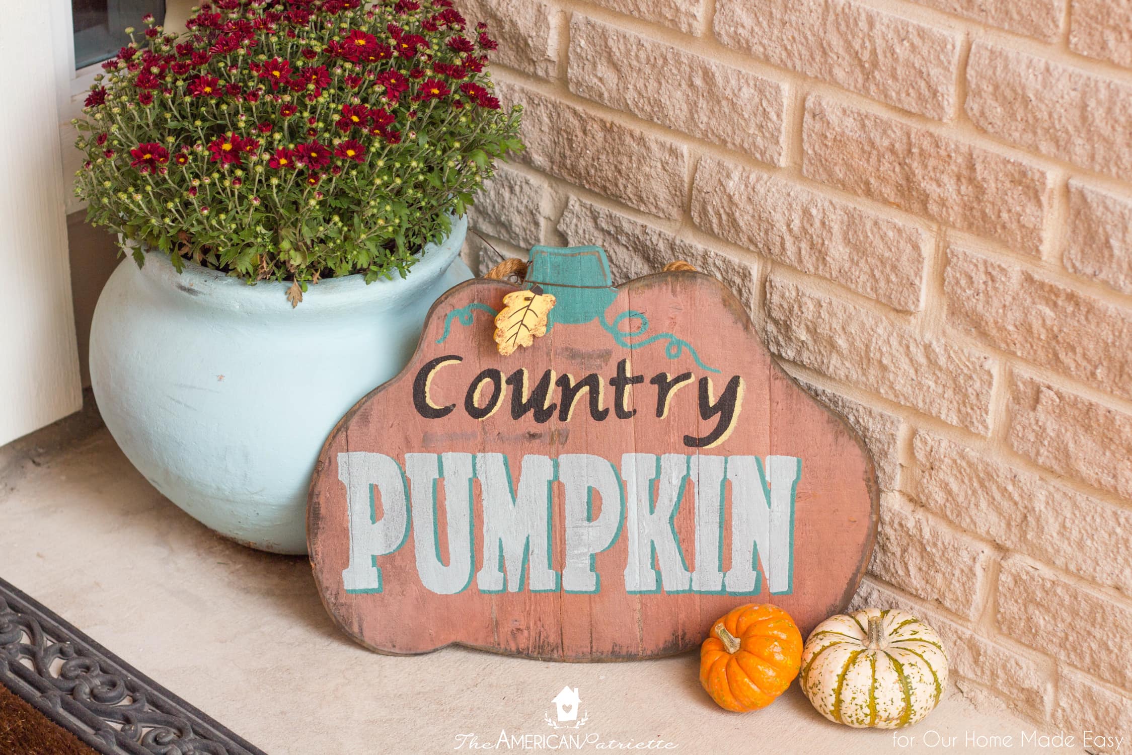 Colorful signs like this country pumpkin sign is a great way to add fun color to your porch