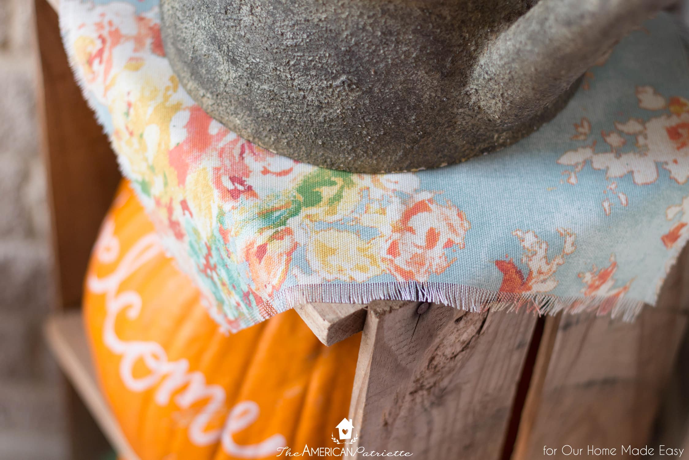 Colorful fabric is an easy way to add to your front porch decor